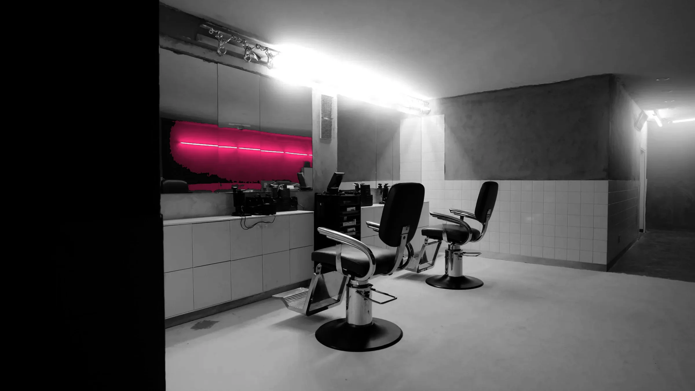 An empty barbershop, chrome and mirrors