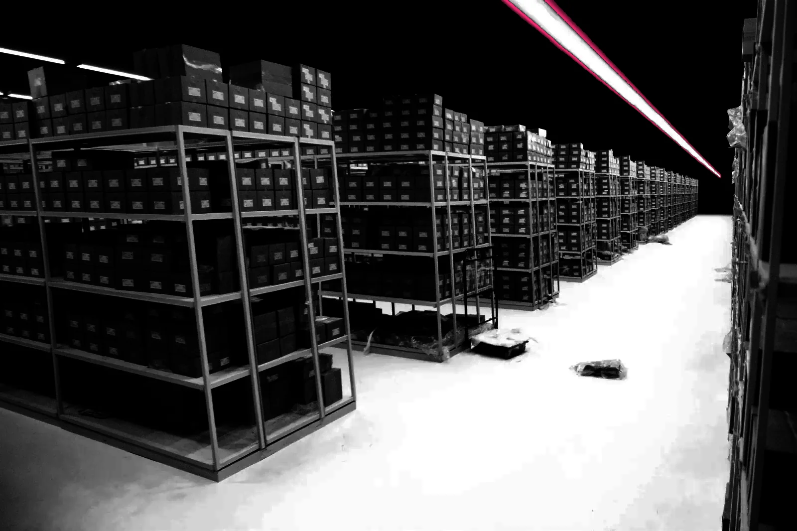Racking receding down a warehouse aisle