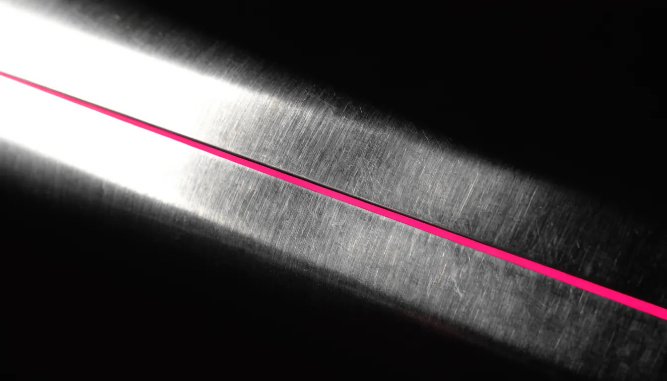 Brushed steel lit at a shallow angle